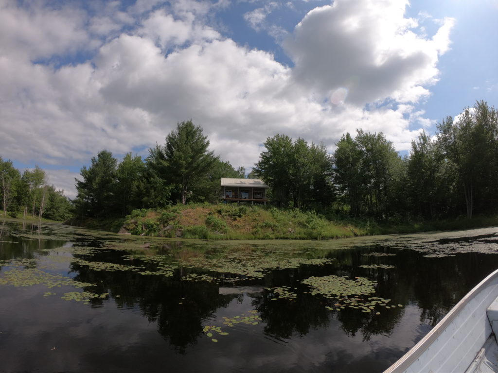 Distant pond view of cabin